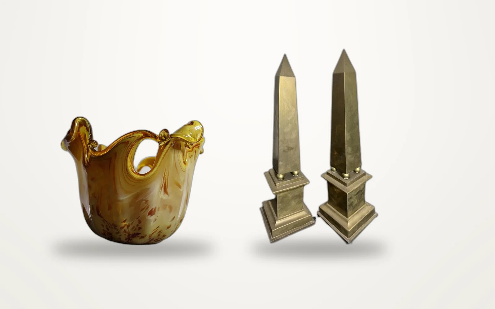 Brass obelisks and an amber glass vase from The Glass Garden
